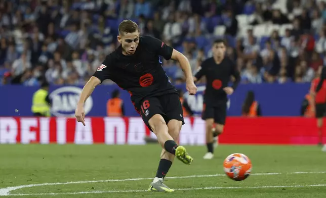 Barcelona's Fermin Lopez scores his side's second goal during a Spanish La Liga soccer match between Barcelona and Espanyol at Lluis Companys Olympic Stadium in Barcelona, Spain, Thursday, May 15, 2025. (AP Photo/Joan Monfort)