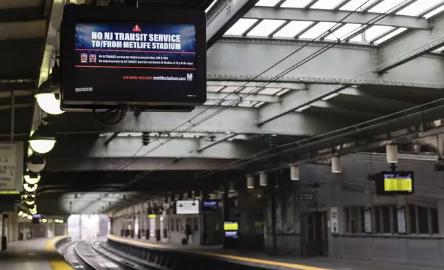 An empty PATH train platform with an information screen informing commuters of the rail service suspension, due to the strike by Union members from the Brotherhood of Locomotive Engineers and Trainmen, inside Newark Penn Station on Friday, May 16, 2025 in Newark, New Jersey. (AP Photo/Stefan Jeremiah)
