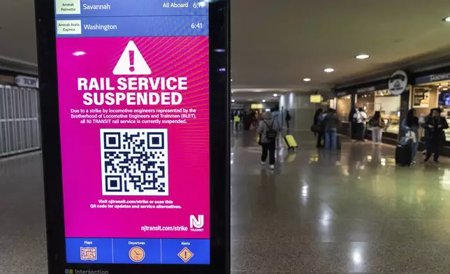 An information screen informing commuters of the rail service suspension, due to the strike by Union members from the Brotherhood of Locomotive Engineers and Trainmen, inside Newark Penn Station on Friday, May 16, 2025 in Newark, New Jersey. (AP Photo/Stefan Jeremiah)