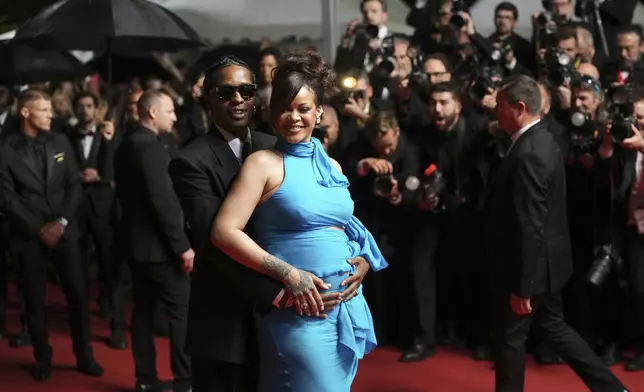 A$AP Rocky, left, and Rihanna pose for photographers upon departure from the premiere of the film 'Highest 2 Lowest' at the 78th international film festival, Cannes, southern France, Monday, May 19, 2025. (Photo by Lewis Joly/Invision/AP)