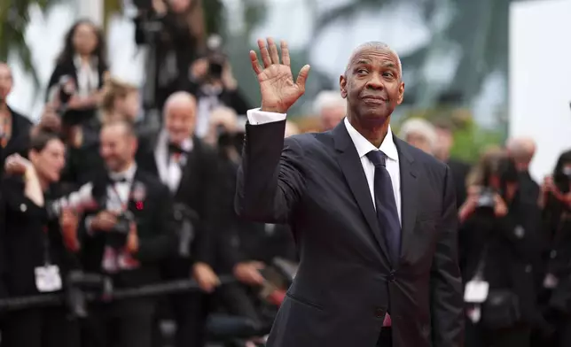 Denzel Washington poses for photographers upon arrival at the premiere of the film 'Highest 2 Lowest' at the 78th international film festival, Cannes, southern France, Monday, May 19, 2025. (Photo by Scott A Garfitt/Invision/AP)