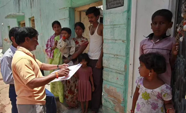 FILE -A census officer collects details of a family in Hyderabad, India, May 11, 2010. (AP Photo/Mahesh Kumar A, File)