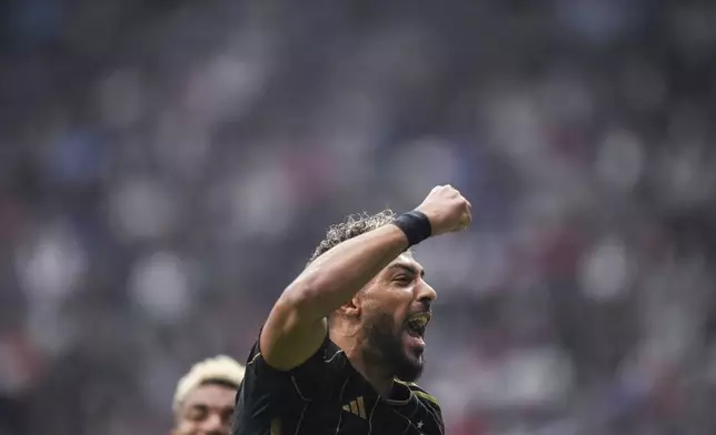 Los Angeles FC's Denis Bouanga celebrates after his penalty kick goal against the Vancouver Whitecaps during the first half of an MLS soccer match in Vancouver, British Columbia, Sunday, May 11, 2025. (Darryl Dyck/The Canadian Press via AP)