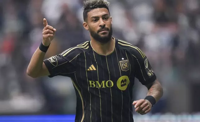 Los Angeles FC's Denis Bouanga celebrates after his penalty kick goal against the Vancouver Whitecaps during the first half of an MLS soccer match in Vancouver, British Columbia, Sunday, May 11, 2025. (Darryl Dyck/The Canadian Press via AP)