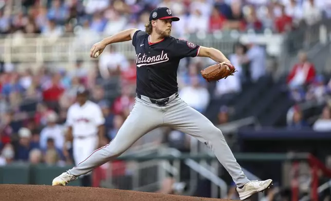 Washington Nationals pitcher Jake Irvin delivers in the first inning of a baseball game against the Atlanta Braves, Monday, May 12, 2025, in Atlanta. (AP Photo/Colin Hubbard)