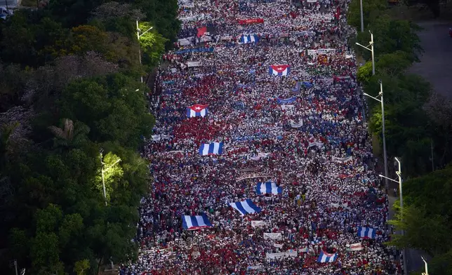 Cubans march to Revolution Square to mark May Day, in Havana, Thursday, May 1, 2025. (AP Photo/Ramon Espinosa)