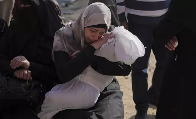 Heba Shakura mourns her son Islam Abu Mahdi who was killed in an Israeli army airstrike, during his funeral at the Indonesian hospital in Beit Lahia, northern Gaza Strip, Monday, April 28, 2025. (AP Photo/Jehad Alshrafi)