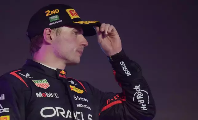 Second placed Red Bull driver Max Verstappen of the Netherlands gestures on the podium during the Formula One Saudi Arabian Grand Prix at the Jeddah Corniche Circuit in Jeddah, Saudi Arabia, Sunday, April 20, 2025. (AP Photo/Darko Bandic)
