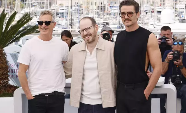 Joaquin Phoenix, from left, director Ari Aster and Pedro Pascal pose for photographers at the photo call for the film 'Eddington' at the 78th international film festival, Cannes, southern France, Saturday, May 17, 2025. (Photo by Joel C Ryan/Invision/AP)