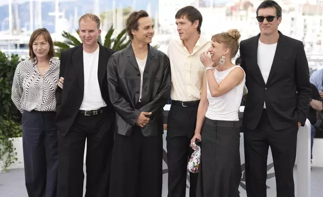 Cinematographer Josee Deshaies, from left, producer Archie Pearch, Frank Dillane, director Harris Dickinson, Megan Northam and Scott O'Donnell pose for photographers at the photo call for the film 'Urchin' at the 78th international film festival, Cannes, southern France, Saturday, May 17, 2025. (AP Photo/Natacha Pisarenko)
