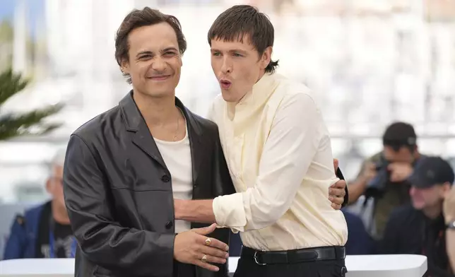 Frank Dillane, left, and Harris Dickinson pose for photographers at the photo call for the film 'Urchin' at the 78th international film festival, Cannes, southern France, Saturday, May 17, 2025. (AP Photo/Natacha Pisarenko)