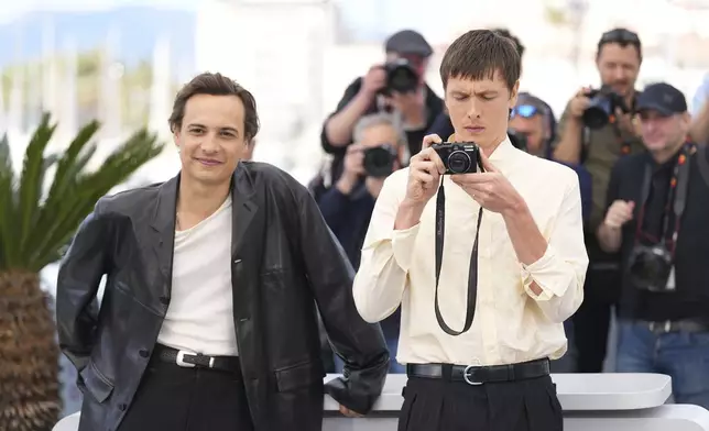 Frank Dillane, left, and Harris Dickinson pose for photographers at the photo call for the film 'Urchin' at the 78th international film festival, Cannes, southern France, Saturday, May 17, 2025. (AP Photo/Natacha Pisarenko)