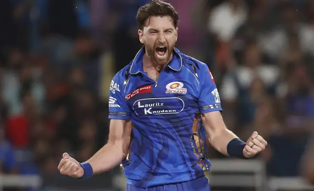 Mumbai Indians' Richard Gleeson celebrates the dismissal of Gujarat Titans' Sai Sudharsan during the Indian Premier League eliminator cricket match between Mumbai Indians and Gujarat Titans at Maharaja Yadavindra Singh Cricket Stadium in Mohali, India, Friday, May 30, 2025. (AP Photo)