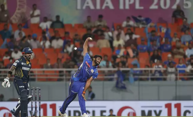 Mumbai Indians' Jasprit Bumrah, right, bowls a delivery during the Indian Premier League eliminator cricket match between Mumbai Indians and Gujarat Titans at Maharaja Yadavindra Singh Cricket Stadium in Mohali, India, Friday, May 30, 2025. (AP Photo)