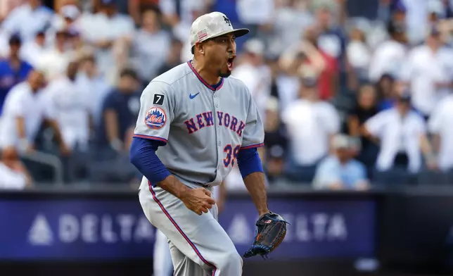 New York Mets pitcher Edwin Díaz (39) reacts after striking out New York Yankees' Aaron Judge to close out the ninth inning of a baseball game, Saturday, May 17, 2025, in New York. (AP Photo/Noah K. Murray)