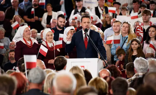 Warsaw's Mayor and presidential candidate Rafal Trzaskowski celebrates exit poll results during the presidential election night in Sandomierz, Poland, Sunday, May 18, 2025. (AP Photo/Aleksander Kalka)