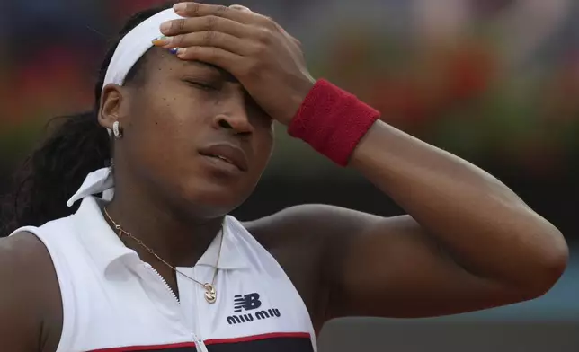 Coco Gauff of the United States, reacts after losing a point to Jasmine Paolini of Italy during their final tennis match in the Italian Open at the Foro Italico in Rome, Saturday, May 17, 2025. (AP Photo/Alessandra Tarantino)