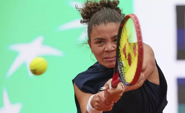 Jasmine Paolini of Italy, eyes on the ball during a final tennis match against Coco Gauff of the United States in the Italian Open at the Foro Italico in Rome, Saturday, May 17, 2025. (AP Photo/Alessandra Tarantino)