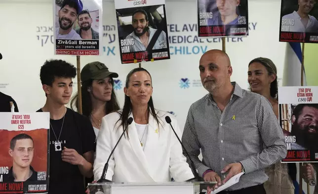 Yael and Adi Alexander, parents of former Israeli-American hostage Edan Alexander, an Israeli soldier who was freed from Hamas captivity yesterday, speak to journalists at Ichilov hospital where he is recovering, in Tel Aviv, Israel, Tuesday, May 13, 2025. (AP Photo/Ohad Zwigenberg)