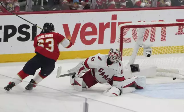 Florida Panthers' Brad Marchand (63) reacts after scoring a goal against Carolina Hurricanes goaltender Pyotr Kochetkov (52) during the third period in Game 3 of the NHL hockey Stanley Cup Eastern Conference finals Saturday, May 24, 2025, in Sunrise, Fla. (AP Photo/Lynne Sladky)