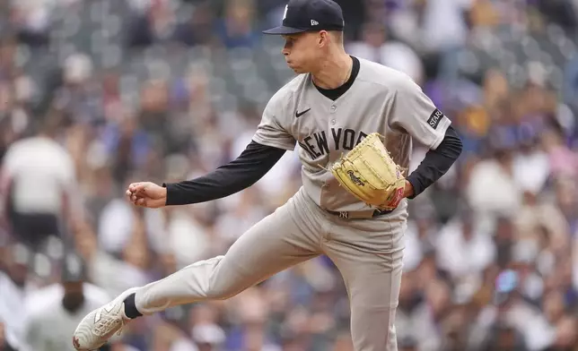 New York Yankees starting pitcher Will Warren works against the Colorado Rockies in the first inning of a baseball game Sunday, May 25, 2025, in Denver. (AP Photo/David Zalubowski)