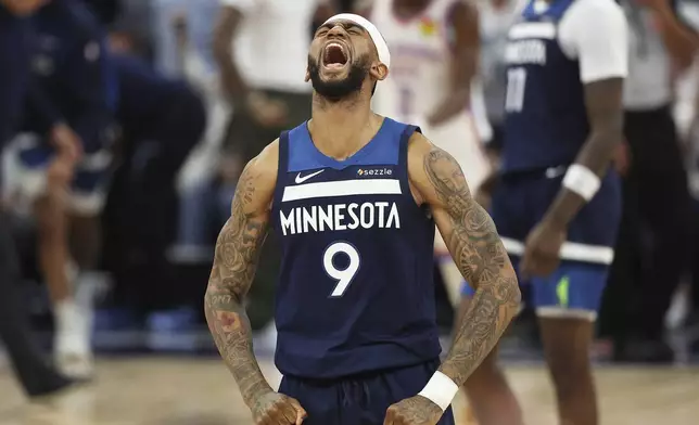 Minnesota Timberwolves guard Nickeil Alexander-Walker (9) celebrates after a 3-point basket by Donte DiVincenzo during the second half of Game 4 of the Western Conference finals of the NBA basketball playoffs against the Oklahoma City Thunder Monday, May 26, 2025, in Minneapolis. (AP Photo/Matt Krohn)