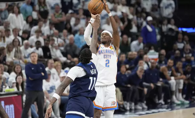 Oklahoma City Thunder guard Shai Gilgeous-Alexander (2) shoots against Minnesota Timberwolves center Naz Reid during the second half of Game 4 of the Western Conference finals of the NBA basketball playoffs Monday, May 26, 2025, in Minneapolis. (AP Photo/Abbie Parr)