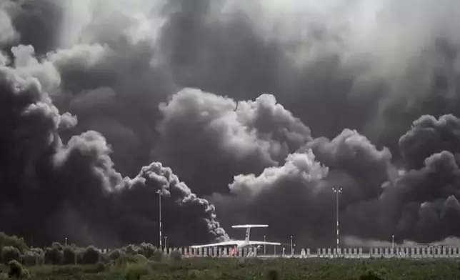 This frame grab from a handout video provided by the Ansar Allah Media Office shows smoke billowing from civilian aircraft following Israeli airstrikes on Sanaa International Airport in Sanaa, Yemen, Tuesday, May 6, 2025.(Courtesy of Ansar Allah Media Office via AP)
