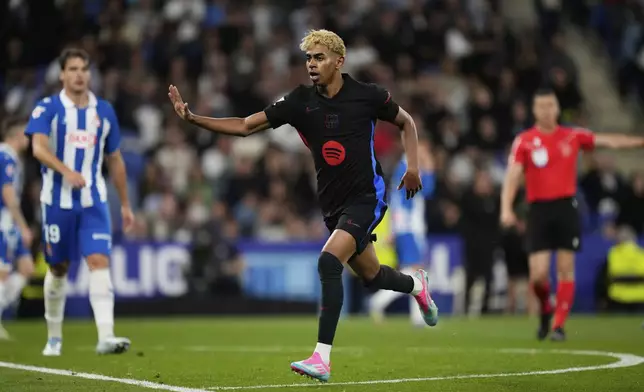 Barcelona's Lamine Yamal reacts after scoring during a Spanish La Liga soccer match between Espanyol and Barcelona in Barcelona, Spain, Thursday, May 15, 2025. (AP Photo/Jose Breton)