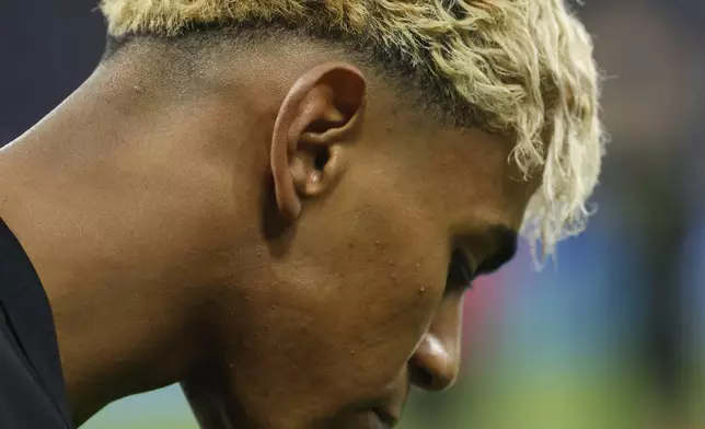Barcelona's Lamine Yamal spits out water as he warms up prior to a Spanish La Liga soccer match between Barcelona and Espanyol at Lluis Companys Olympic Stadium in Barcelona, Spain, Thursday, May 15, 2025. (AP Photo/Joan Monfort)