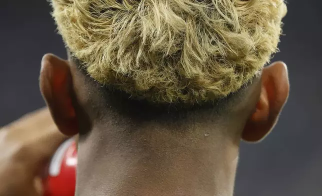 Barcelona's Lamine Yamal drinks water as he warms up prior to a Spanish La Liga soccer match between Barcelona and Espanyol at Lluis Companys Olympic Stadium in Barcelona, Spain, Thursday, May 15, 2025. (AP Photo/Joan Monfort)
