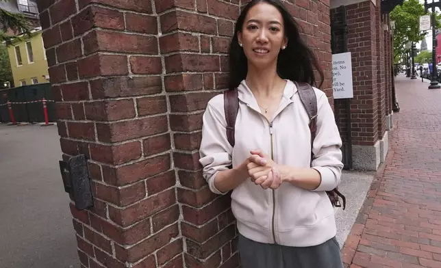 Yurong "Luanna" Jiang, who delivered a speech at her Harvard University commencement, poses at a gate to Harvard Yard, Friday, May 30, 2025, in Cambridge, Mass. (AP Photo/Charles Krupa)