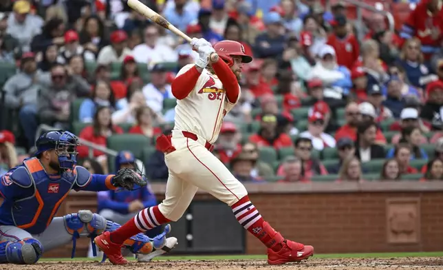 St. Louis Cardinals' Brendan Donovan, right, hits a two-run single as New York Mets catcher Luis Torrens, left, watches in the fourth inning during the first baseball game of a doubleheader, Sunday, May 4, 2025, in St. Louis. (AP Photo/Joe Puetz)