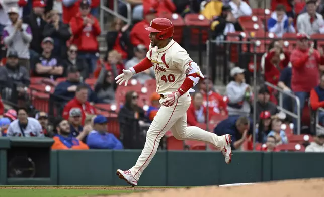 St. Louis Cardinals' Willson Contreras rounds third base after hitting a solo home run in the second inning during the first baseball game of a doubleheader against the New York Mets, Sunday, May 4, 2025, in St. Louis. (AP Photo/Joe Puetz)