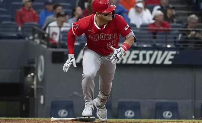 Los Angeles Angels' Mike Trout watches his single off Cleveland Guardians starting pitcher Luis Ortiz during the fourth inning of a baseball game, Friday, May 30, 2025, in Cleveland. (AP Photo/Phil Long)