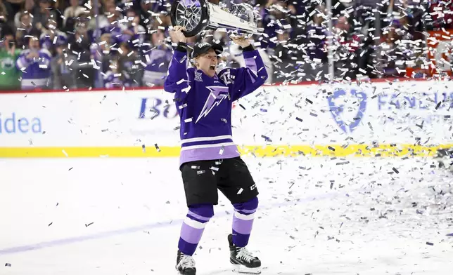 Minnesota Frost forward Kendall Coyne Schofield celebrates with the Walter Cup after her team won the PWHL hockey finals against the Ottawa Charge, Monday, May 26, 2025, in St. Paul, Minn. (AP Photo/Ellen Schmidt)