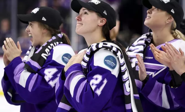 Minnesota Frost forward Liz Schepers (21) accepts applause after scoring the winning goal to defeat the Ottawa Charge in Game 4 of the PWHL hockey finals Monday, May 26, 2025, in St. Paul, Minn. (AP Photo/Ellen Schmidt)