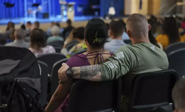 Families and members of the military gather for service at Pillar Church in Dumfries, Va., on Sunday April 6, 2025. (AP Photo/Jessie Wardarski)