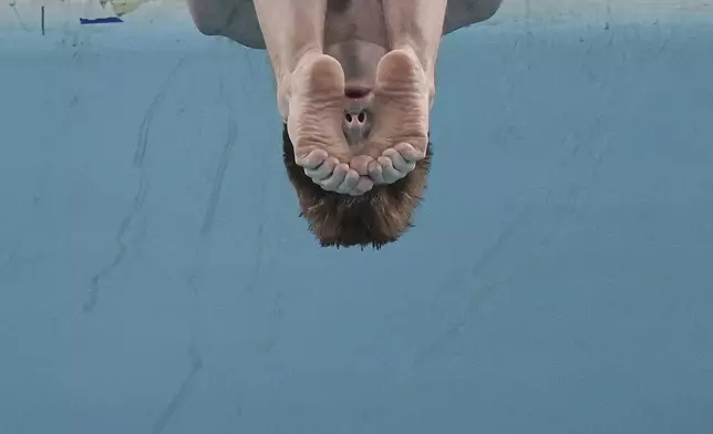 Oleksii Sereda of Ukraine competes in the Men's 10m Platform event for the Diving World Cup Super Final held at the Water Cube, in Beijing, Sunday, May 4, 2025. (AP Photo/Andy Wong)