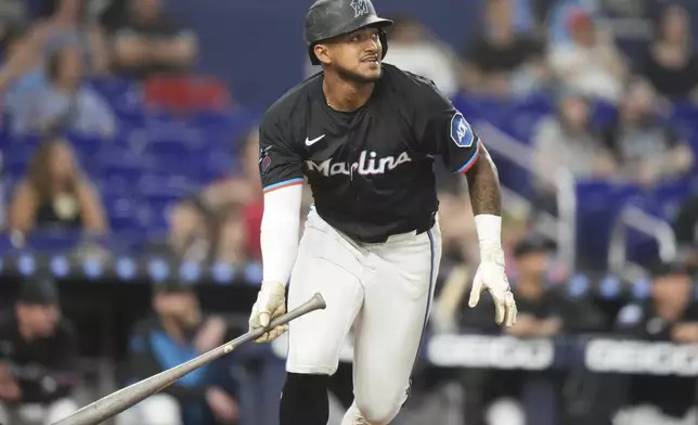 Miami Marlins' Dane Myers watches after hitting a solo home run during the sixth inning of a baseball game against the Oakland Athletics, Friday, May 2, 2025, in Miami. (AP Photo/Lynne Sladky)
