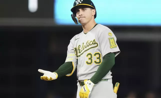 Oakland Athletics' JJ Bleday (33) reacts after hitting s double during the fifth inning of a baseball game against the Miami Marlins, Friday, May 2, 2025, in Miami. (AP Photo/Lynne Sladky)