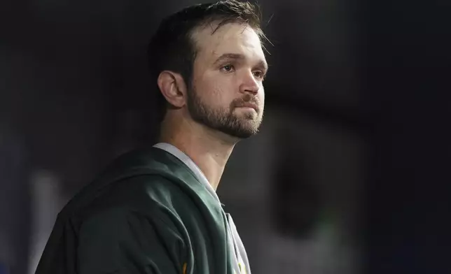 Oakland Athletics starting pitcher Gunnar Hoglund looks from the dugout after pitching in the fifth inning of a baseball game against the Miami Marlins, Friday, May 2, 2025, in Miami. (AP Photo/Lynne Sladky)