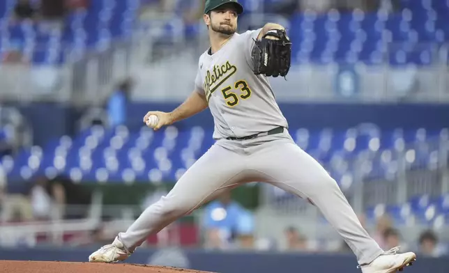 Oakland Athletics starting pitcher Gunnar Hoglund throws during the first inning of a baseball game against the Miami Marlins, Friday, May 2, 2025, in Miami. (AP Photo/Lynne Sladky)