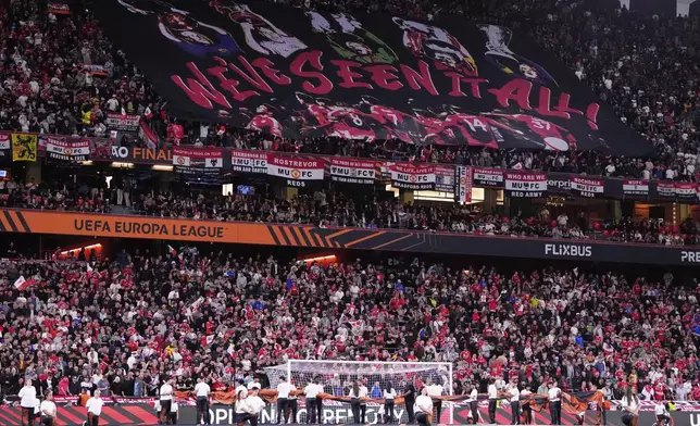 Manchester United fans cheer during the Europa League final soccer match between Tottenham Hotspur and Manchester United at the San Mames Stadium in Bilbao, Spain, Wednesday, May 21, 2025. (AP Photo/Jose Breton)