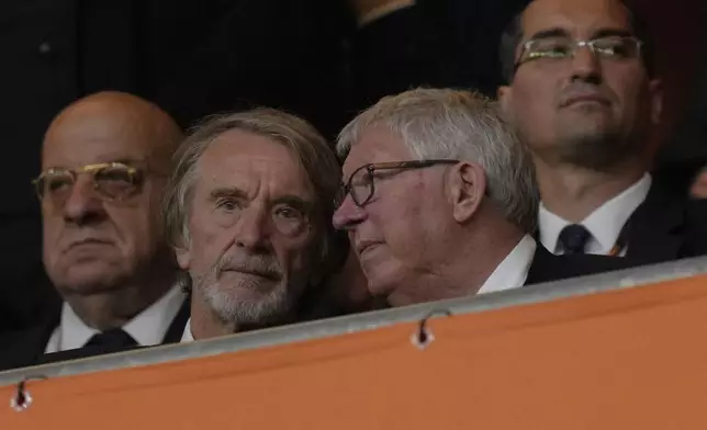Sir Alex Ferguson, right, speaks to Sir Jim Ratcliffe during the Europa League final soccer match between Tottenham Hotspur and Manchester United at the San Mames Stadium in Bilbao, Spain, Wednesday, May 21, 2025. (AP Photo/Bernat Armangue)