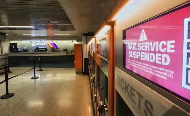 A suspended service notice is displayed on a NJ Transit train ticket vending machine, due to a strike by New Jersey Transit train engineers, at Penn Station in New York, Friday, May 16, 2025. (AP Photo/Richard Drew)