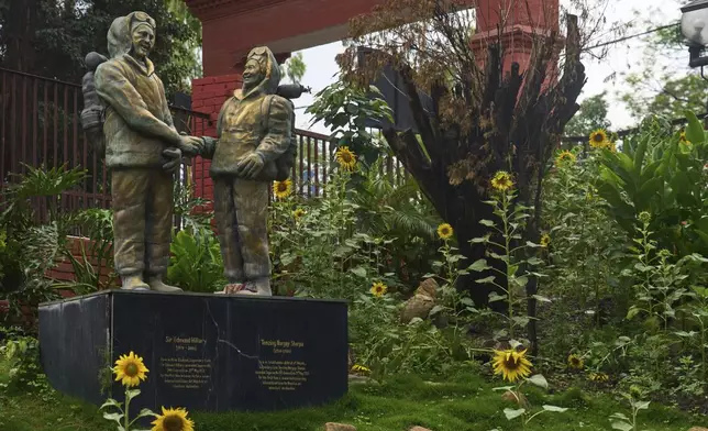 The statues of New Zealander Edmund Hillary, left, and his Sherpa guide Tenzing Norgay, who became the first climbers to reach the top of 8,850-meter (29,035-foot) Everest on May 29, 1953 is seen in Kathmandu, Nepal, Thursday, May 29, 2025. (AP Photo/Niranjan Shrestha)