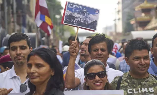 People from the mountaineering community participate in a rally to mark the anniversary of the first ascent of Mount Everest in Kathmandu, Nepal, Thursday, May 29, 2025. (AP Photo/Niranjan Shrestha)