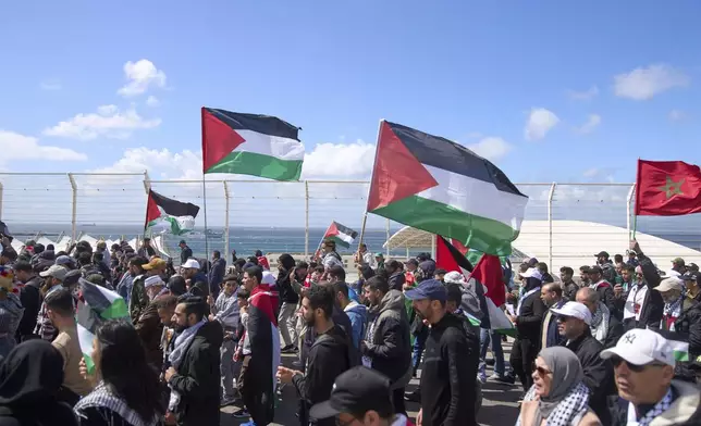 Moroccans protest the docking of a Maersk cargo ship carrying airplane parts they suspect are headed to Israel, outside Tangier Med Port, Sunday, April 20, 2025. (AP Photo/Mosa'ab Elshamy)