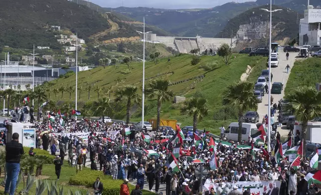 Moroccans protest the docking of a Maersk cargo ship carrying airplane parts they suspect are headed to Israel, outside Tangier Med Port, Sunday, April 20, 2025. (AP Photo/Mosa'ab Elshamy)